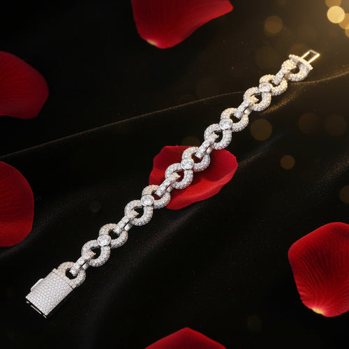 Silver bracelet on a black surface with GRA Moissanite branding.