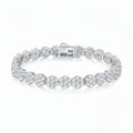 Silver bracelet with clear gemstones on a white background