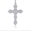 Diamanté cross pendant necklace on a white background